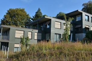 New construction of a multi-family house on a slope